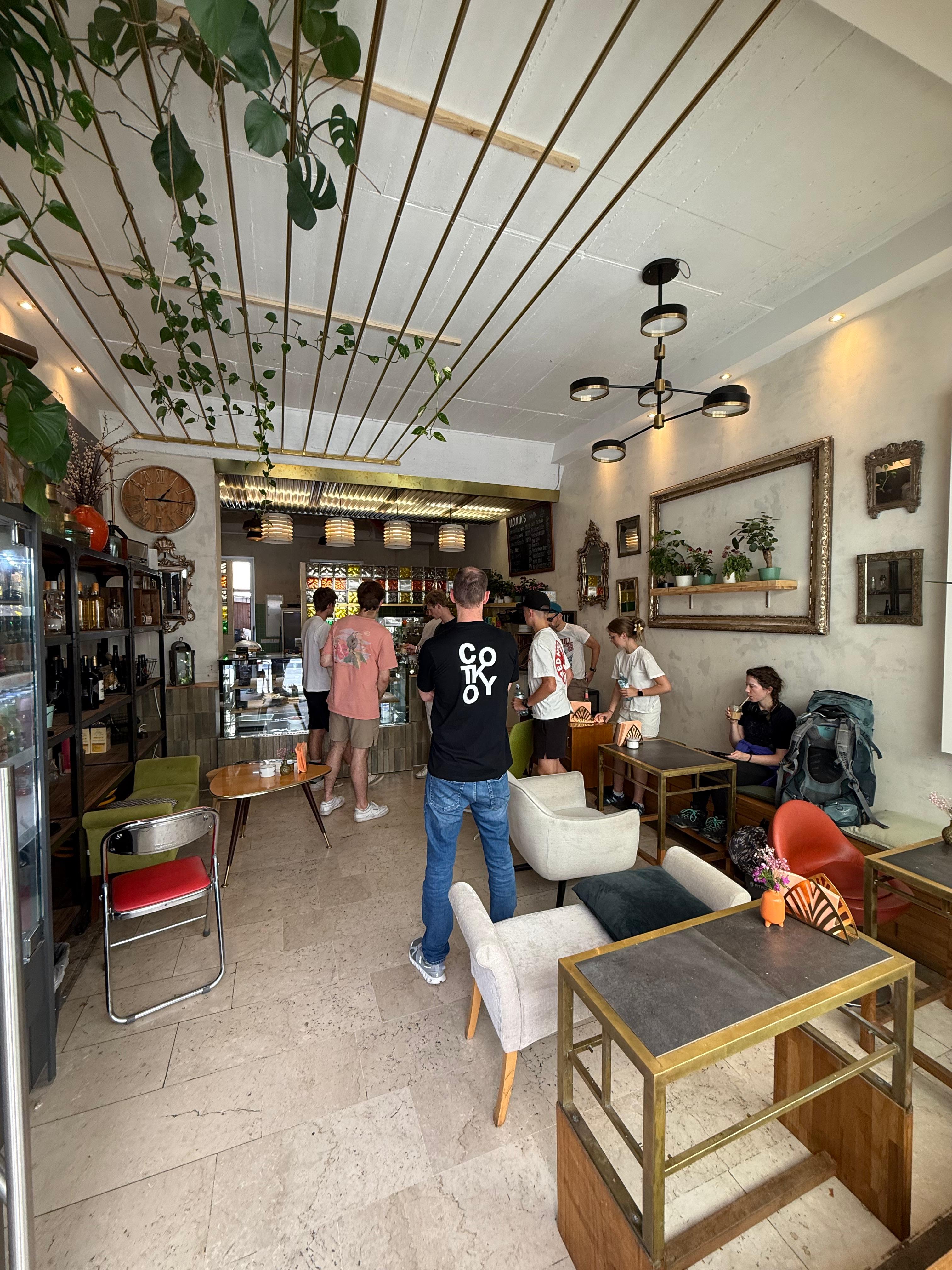 Nonna’s Café interior with cozy seating and plants